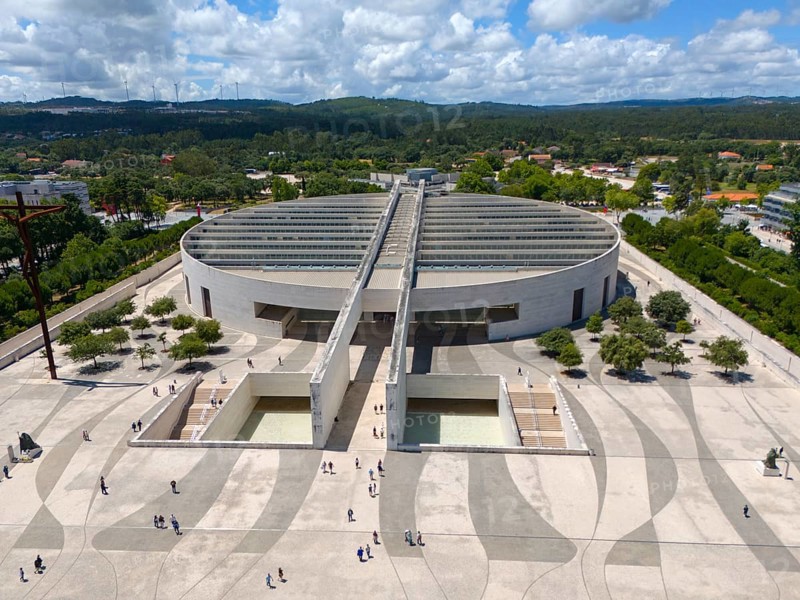 Modern architecture with a large square and people, surrounded by trees and forests, under a cloudy sky, aerial view, Basilica of the Most Holy Trinity, Basilica da Santissima Trindade, place of pilgrimage, Fatima, Fátima, Ourem, Santarem, Portugal, Europe