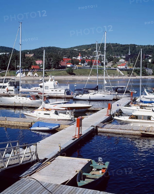 Boats moored at Tadoussac Marina in summer, North Shore, Quebec, Canada, North America