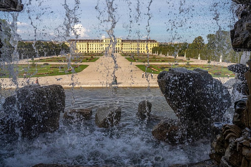View through the Neptune Fountain to Schönbrunn Park and Palace, UNESCO World Heritage Site in Vienna, Austria, Europe