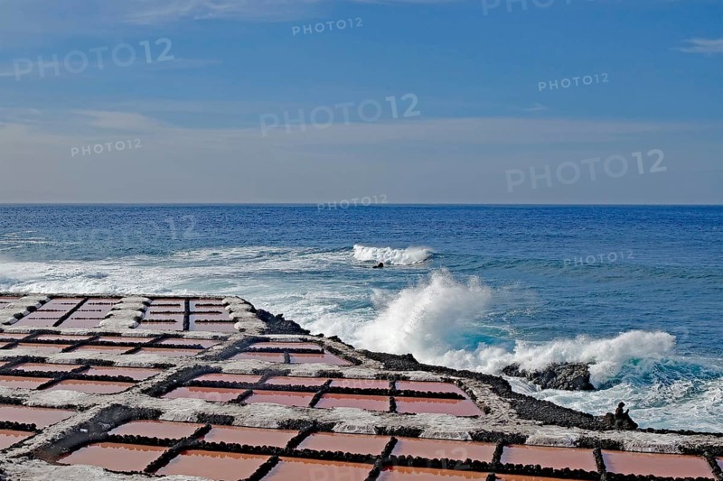 Coast with salt pans in the foreground, the sea with powerful waves in the background, salt pans, Fuencialente, La Palma, Canary Islands, Spain, Europe