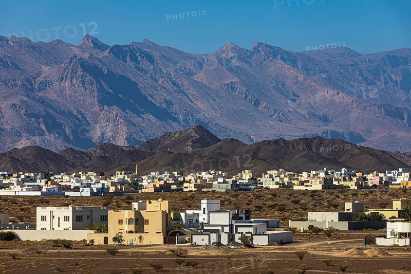 The new settlement of Jabrin, view from the palace fortress of Jabrin, behind the mountains of Jebel Akhdar, near the city of Bahla, Arabian Peninsula, Sultanate of Oman