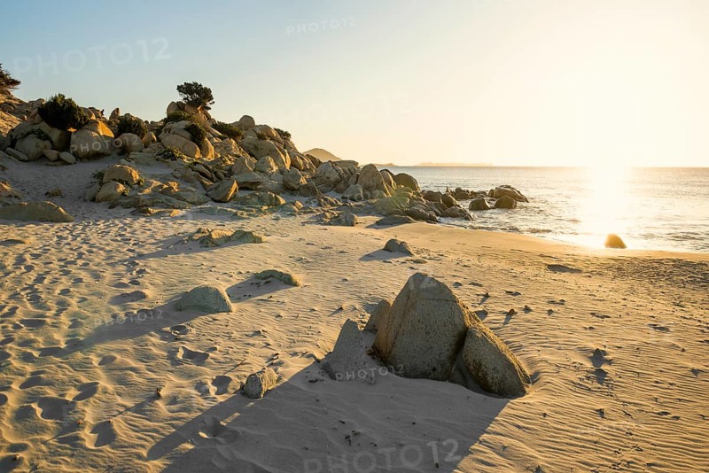 Lonely beach and rocks, sunrise, Spiaggia di Porto Giunco, Villasimius, south coast, Sardinia, Italy, Europe