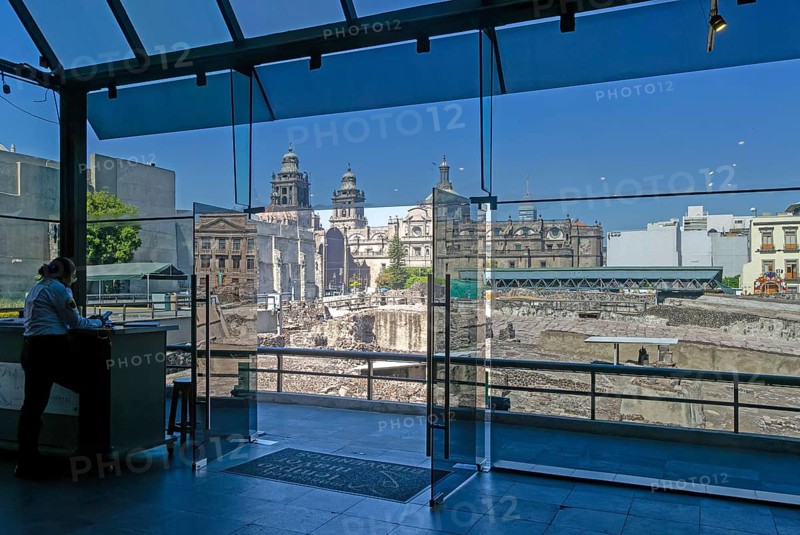 Templo Mayor archaeological Aztec city of Tenochtitlan, view to the cathedral church from inside museum, Mexico City, Mexico, Central America