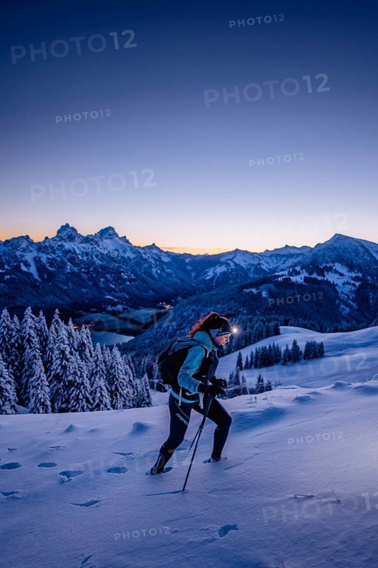 Hiking in the snow in the snow-covered winder landscape in the Alps at Neunerköpfle in the Tannheimer Tal in Tyrol, Austria, Europe