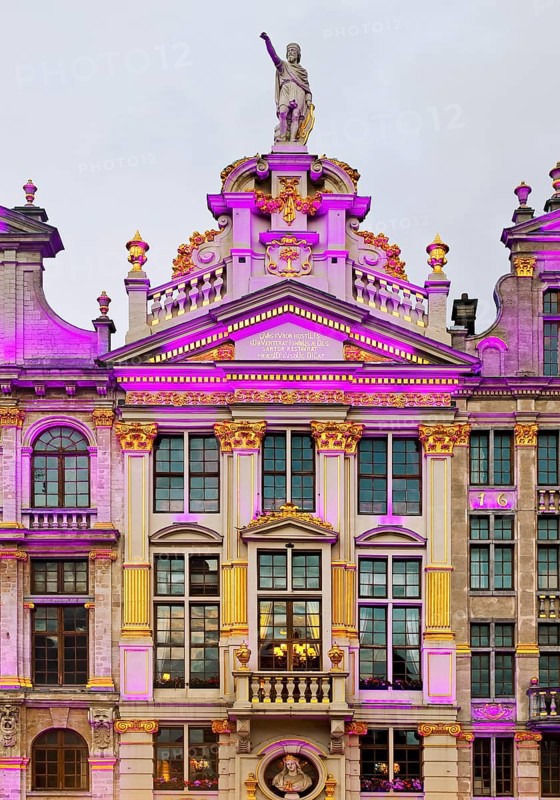 The illuminated statue of Bishop Boniface of Lausanne on the guildhall La Chaloupe d'Or, Grand-Place, Grote Markt, Brussels, Belgium, Europe