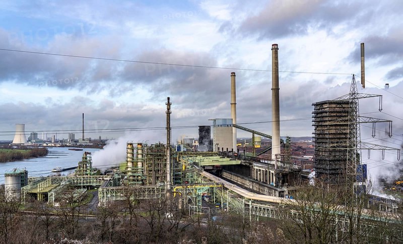 The Schwelgern coking plant supplies over 2.5 million tonnes of coke to Thyssenkrupp Steel's Schwelgern blast furnace plant on the Rhine, considered the most modern coking plant in the world with the world's largest coke oven batteries, on the left the so-called white side, a chemical factory that generates many by-products from the coking process, in the background the STEAG combined heat and power plant Duisburg-Walsum, North Rhine-Westphalia, Germany, Europe
