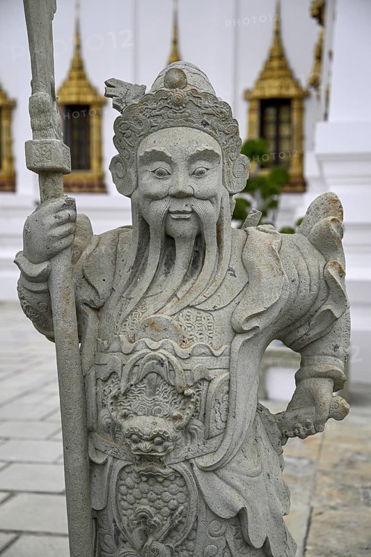 Stone statue of a Chinese warrior, guardian, Wat Phra Kaew, Temple of the Emerald Buddha, Bangkok, Thailand, Asia