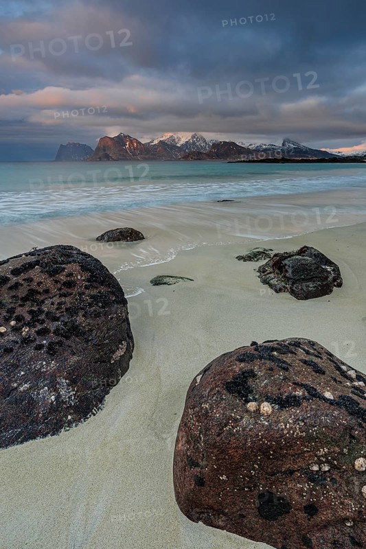 Rocks and beach in front of Bergen, sea, surf, spray, clouds, winter, Flakstadoya, Lofoten, Norway, Europe
