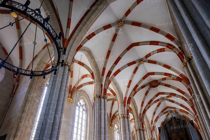 The Divi Blasii Church is a three-nave, cruciform hall church on the Untermarkt square in the town of Mühlhausen in Thuringia. The elaborately designed façade with tracery, pinnacles and a wheel window on the north side is located on an old trade route, Divi Blasii Church, Mühlhausen, Thuringia, Germany, Europe