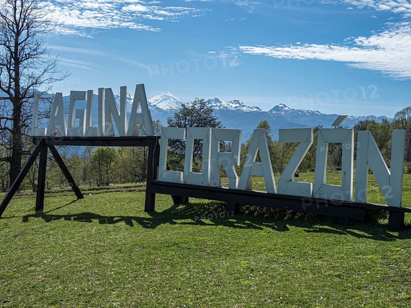 Large wooden letters buliding the words 'Laguna Corazon', parking lot at trail to heart-shaped lake Laguna Corazon, near Liquine, Chile, South America