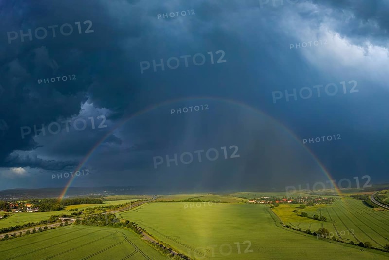 Thunderstorm cell with rainbow over fields near Krebs in the Osterzgebirge, Krebs, Saxony, Germany, Europe