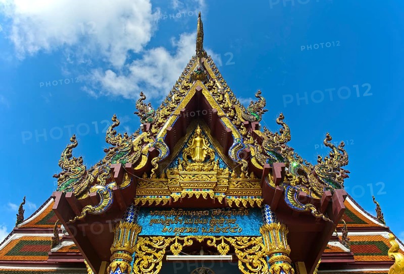 Decorated pediment of the ordination hall, also Bot, of the temple Wat Plai Laem with multi-levelled roof with Naga snake as pointed volute, Koh Samui, Thailand, Asia