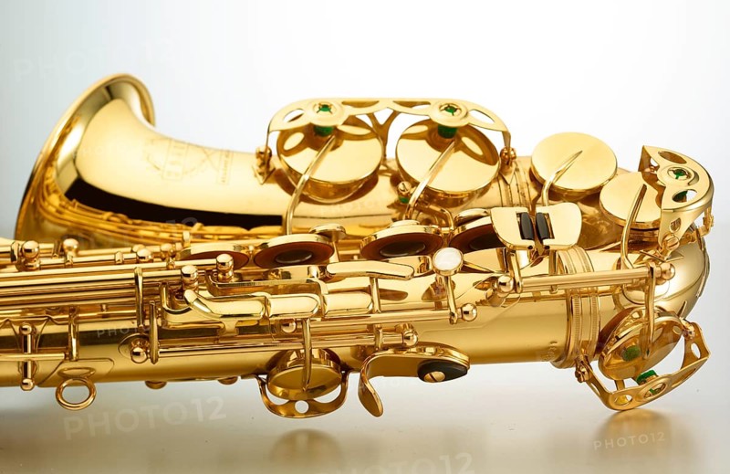Saxophone in front of white background, detail, studio shot