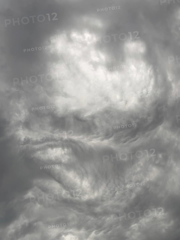 Cloud formation after storm warning thunderstorm warning grey dark clouds shortly in front of thunderstorm swirled by storm torn clouds thunderclouds, North Rhine-Westphalia, Germany, Europe