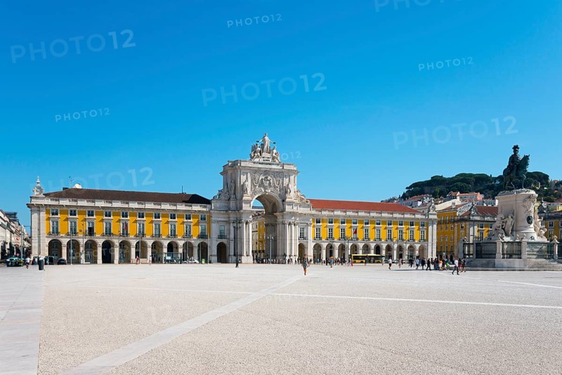 Spacious square with a large yellow building, arcades and a statue, all under a clear blue sky, triumphal arch, Arco da Rua Augusta, equestrian statue of King Joseph I, Praça do Comércio, Commerce Square, Terreiro do Paço, palace grounds, Lisbon, Lisboa, Portugal, Europe