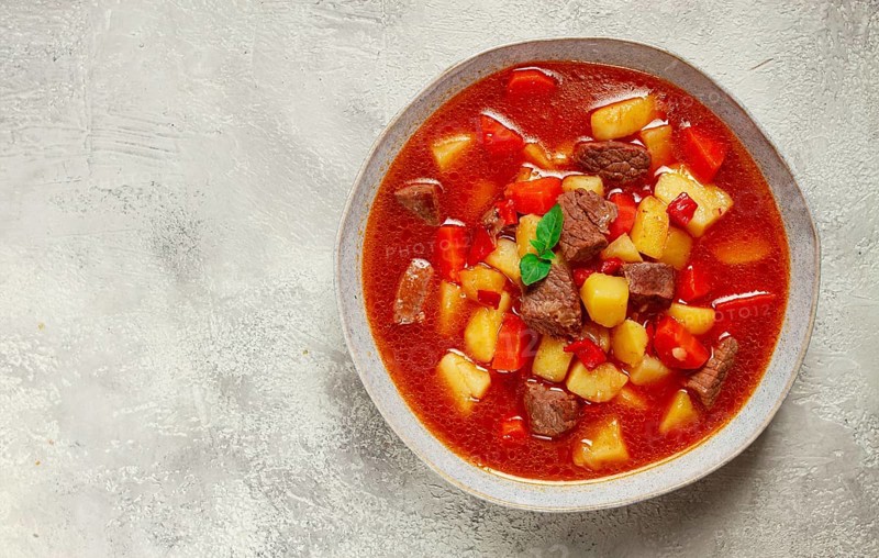 Meat goulash, with potatoes and carrots, sweet pepper, traditional Hungarian soup, homemade, no people