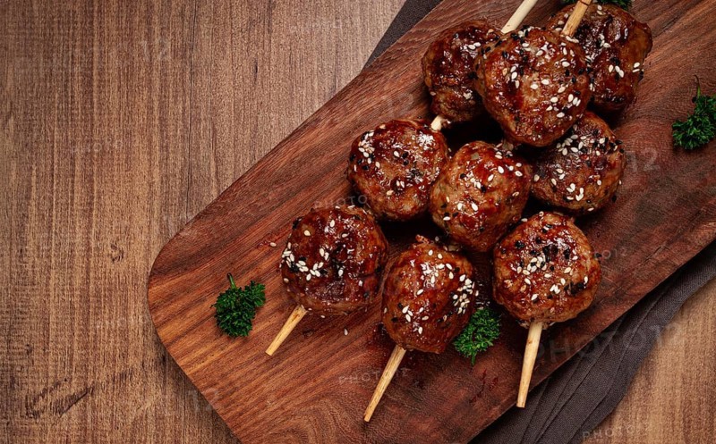 Tsukune, Japanese meatballs, minced chicken, fried on a skewer, with yakitori sauce, homemade, no people