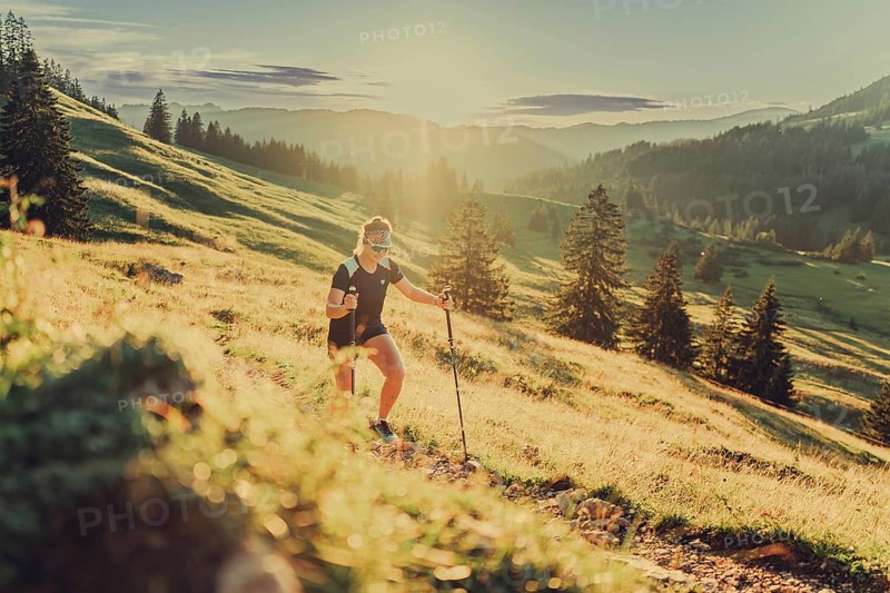 Summer trail running and hiking in the Alps on the Riedberg Pass between Obermaiselstein and Balderschwang in the Allgäu, Bavaria, Germany, Europe