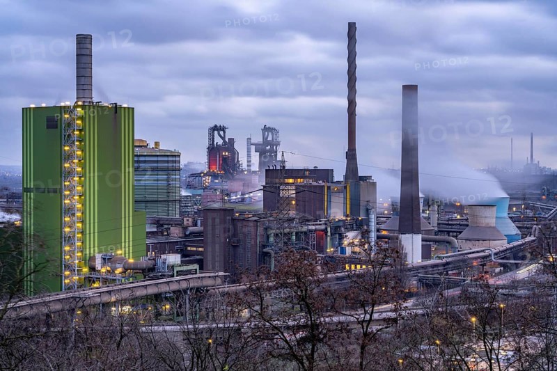 Panorama of the Thyssenkrupp Steel steelworks in Duisburg-Bruckhausen, in front the gas-fired power plant Hamborn, green facade of the boiler house Block5, in the centre the blast furnaces 8 and 9, North Rhine-Westphalia, Germany, Europe