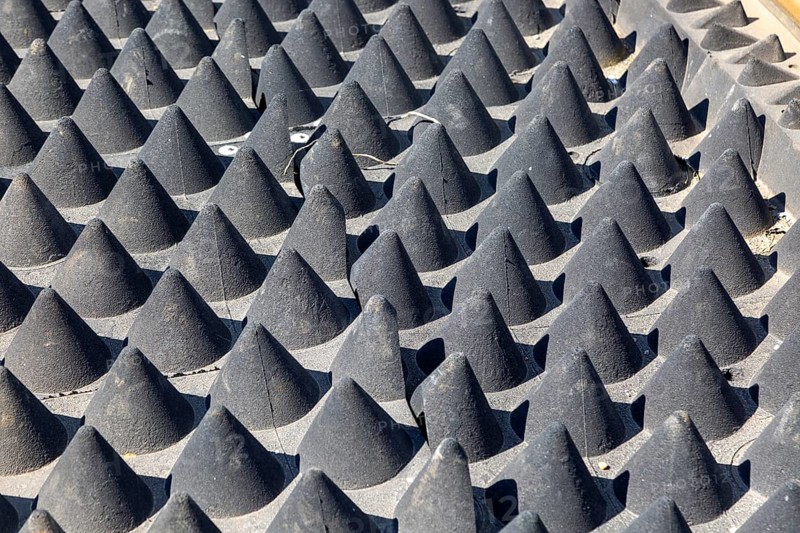 Soft rubber cones used on railway line to deter walkers, Suffolk, England, UK