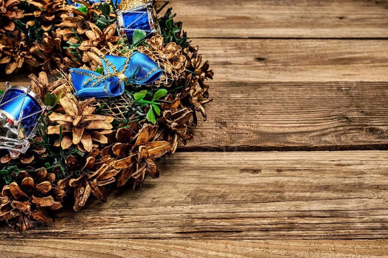 Christmas wreath on old wooden background close up