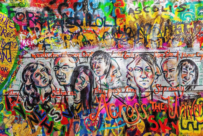PRAGUE, CZECH REPUBLIC, APRIL 28, 2012: Lennon Wall is filled with John Lennon-inspired graffiti and pieces of lyrics from Beatles songs