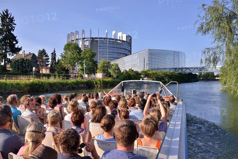 Excursion boat with tourists in front of the buildings of the European Parliament, Strasbourg, Département Bas-Rhin, Alsace, France, Europe