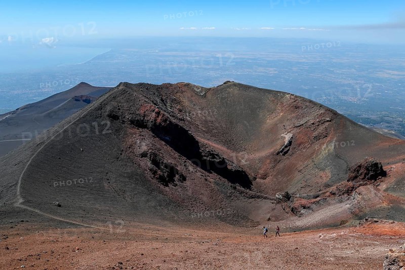 Hikers in the crater landscape of the volcano Etna, summit region, province of Catania, Sicily, Italy, Europe
