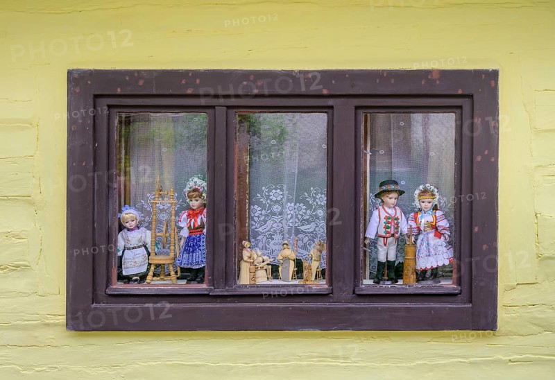 Window with traditional traditional costume dolls, Vlkolinec village, Unesco World Heritage Site, Ružomberok, Žilinský kraj, Slovakia, Europe