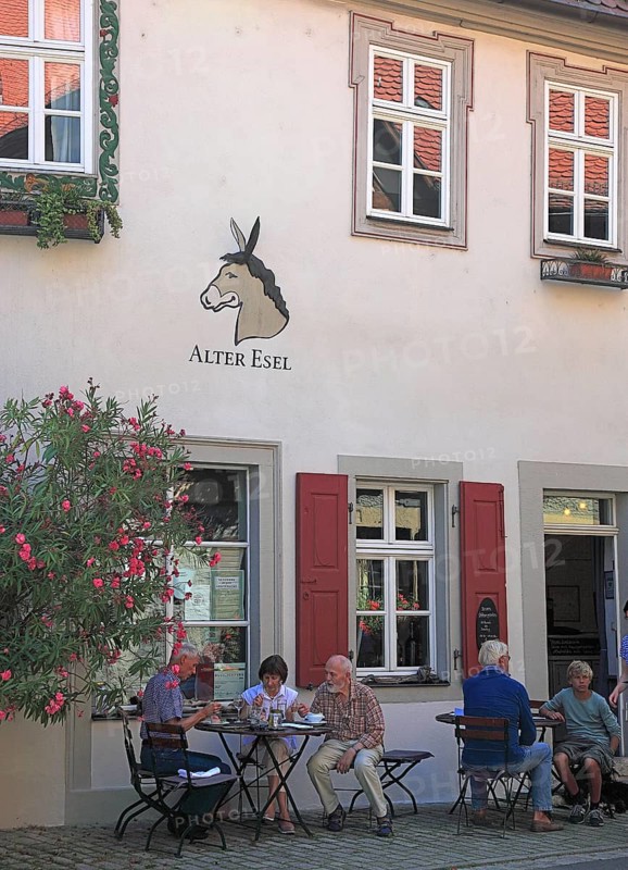 Germany, Bavaria, Lower Franconia, district of Kitzingen, town of Marktbreit, house facade, restaurant with inscription, old donkey, Europe