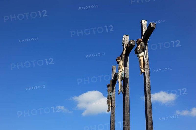 The three crosses on the Kreuzberg near the city of Bischofsheim an der Rhön, Rhön-Grabfeld district, Lower Franconia, Bavaria, Germany. The three crosses on the Kreuzberg near the city of Bischofsheim, Rhön Mountains, Lower Frankonia, Bavaria, Germany, Europe