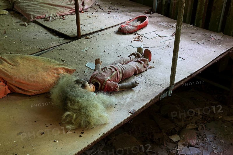 In the closed and uninhabitable 30-kilometre zone around the Chernobyl power plant and the workers' settlement of Pripyat, in the former kindergarten, doll and child's shoe, Kiev, Ukraine, Europe