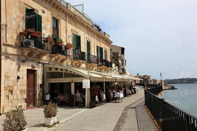 Ortygia or Ortigia is the historic centre of the city of Syracuse, old town house front by the sea, Sicily, Italy, Europe