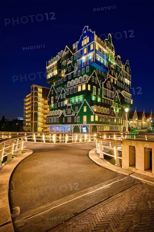 ZAANDAM, NETHERLANDS, MAY 8, 2017: Inntel Hotel in Zaandam illuminated at night. Design of 12-storey tall building opened in 2009 is the result of stacking a series of traditional Dutch houses