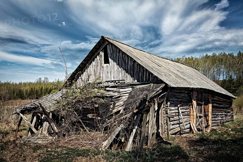 Old ruined abandoned rural house in countryside