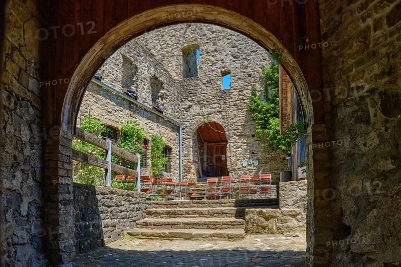 View through the castle gate into the castle courtyard, medieval castle ruins Sulzberg in Allgäu near Kempten, Bavaria, Germany, Europe