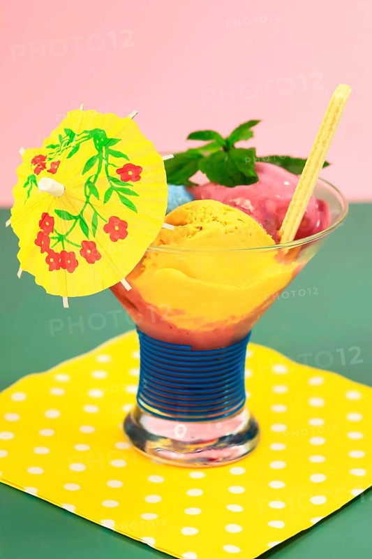 Sundae with homemade ice cream, yellow umbrella, ice cream cone and mint leaves, summer, Germany, Europe