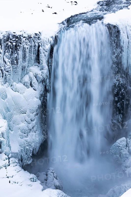 Dettifoss waterfall with icy and snow-covered rock face, Northern Iceland Eyestra, Iceland, Europe