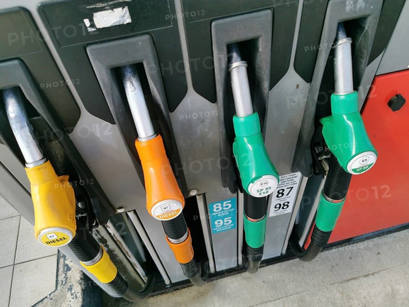 Petrol pump with nozzles for petrol and diesel at a motorway filling station in France