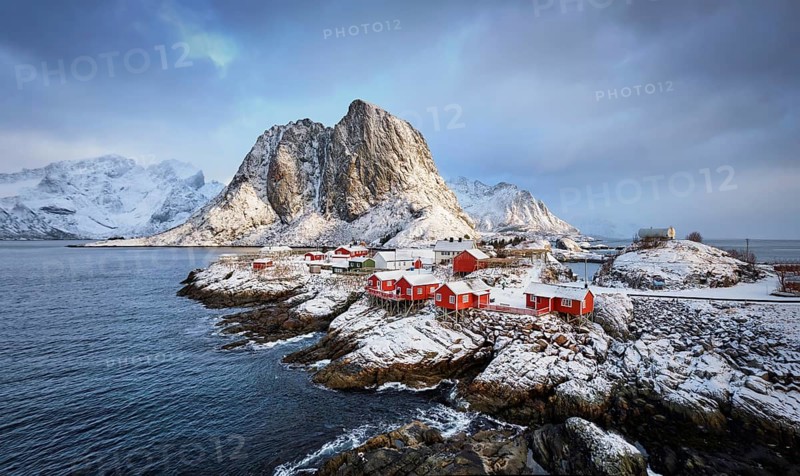 Famous tourist attraction Hamnoy fishing village on Lofoten Islands, Norway with red rorbu houses in winter
