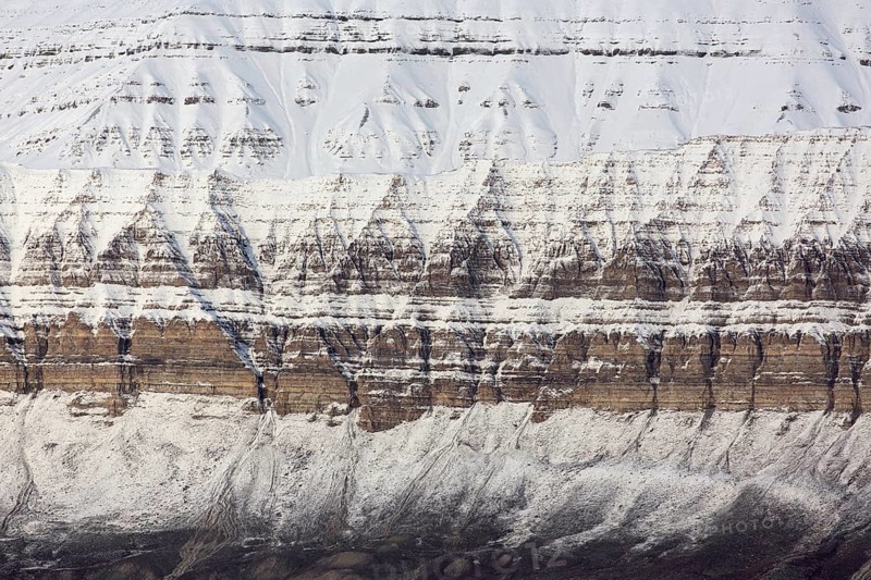 Snow covered Carboniferous mountain slope showing strata in autumn, Billefjord, Billefjorden, Svalbard, Spitsbergen, Norway, Europe