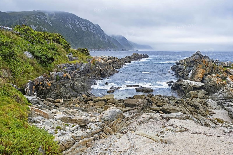Rocky coastline along the Indian Ocean in the Tsitsikamma Section of the Garden Route National Park, Eastern Cape Province, South Africa, Africa