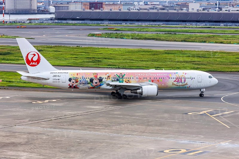A Boeing 767-300ER aircraft of Japan Airlines JAL with the registration JA614J and the Tokyo Disney Resort special livery at Tokyo Haneda Airport (HND) in Tokyo, Japan, Asia
