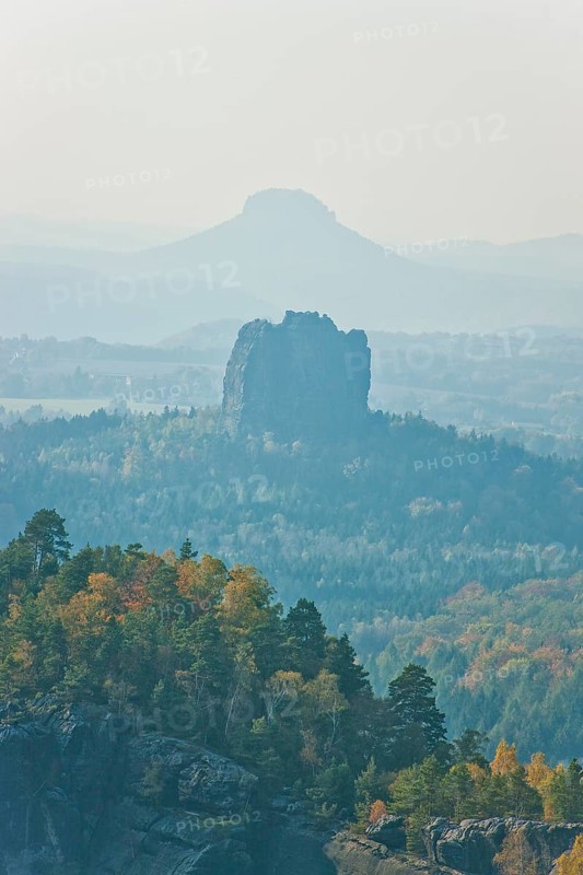 View from the Carola rock into the Schrammstein area in the back of Saxon Switzerland, to the Falkenstein and the Lilienstein