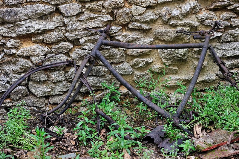Remains of a burnt bicycle. The burnt village of Oradour-sur-Glane was destroyed on 10 June 1944 when 642 of its inhabitants, including woman and children, were massacred by a German Waffen SS company, Limousin, France, Europe