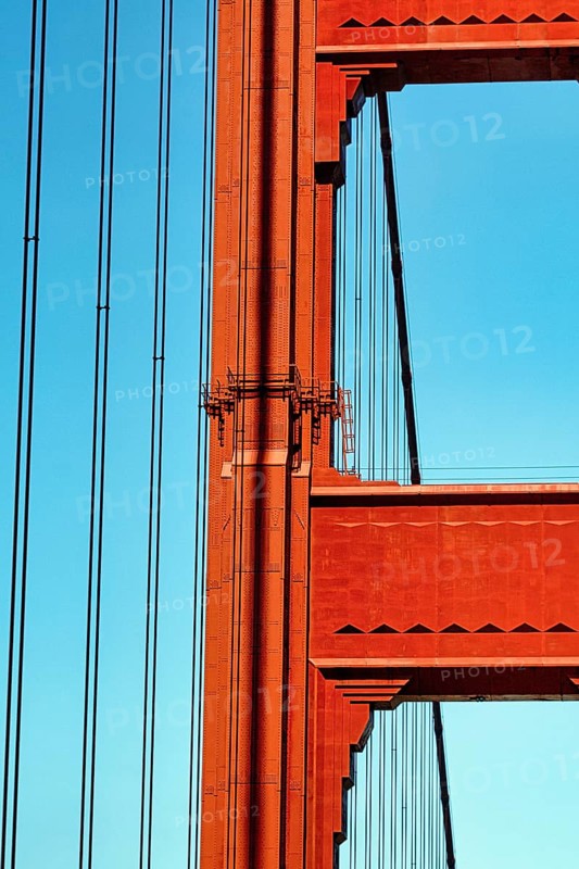 Orange pylon and steel cables of the suspension bridge, detail, Golden Gate Bridge, blue sky, San Francisco, California, USA, North America