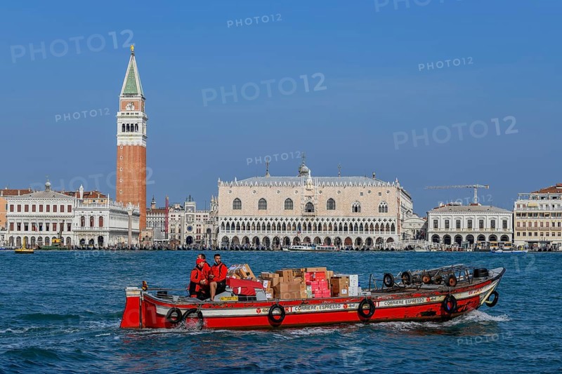 Delivery boat of the parcel service DPD on the Grand Canal in front of the Markusturm and the Doge's Palace, San Marco district, Venice, Veneto region, Italy, Europe