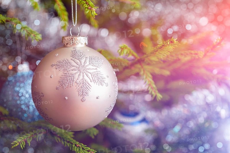 Christmas celebration holiday background, christmas-tree decoration bauble on decorated Christmas tree with defocused blurred lights bokeh and copyspalce