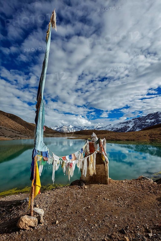 Small gompa with buddhist prayer flags at sacred Dhankar Lake. Spiti Valley, Himachal Pradesh, India, Asia