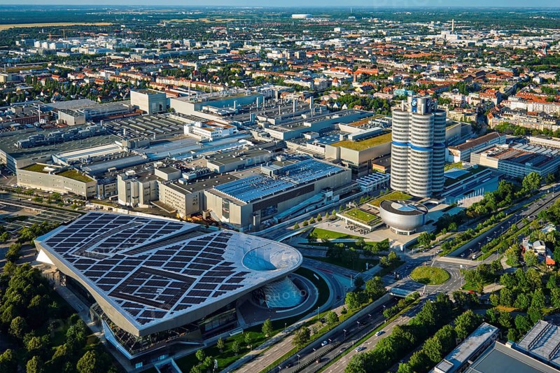 MUNICH, GERMANY, JULY 08, 2018: Aerial view of BMW Museum and BWM Welt and factory and Munich from Olympic Tower. BMW is a famous German luxury car automaker
